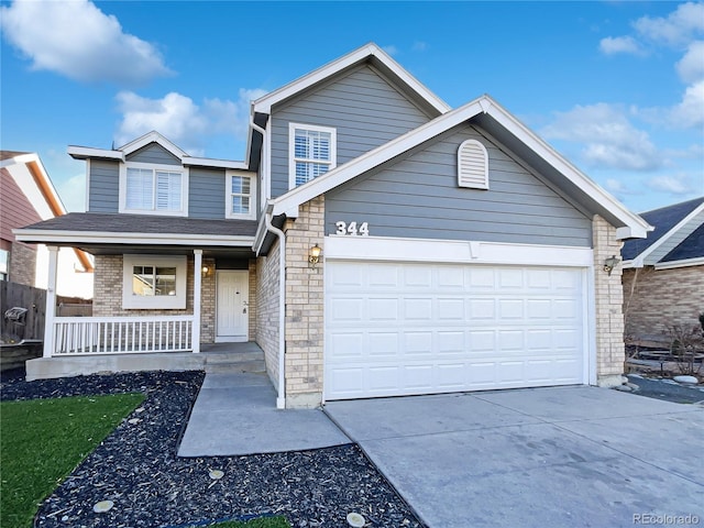 view of front of property with a garage and a porch