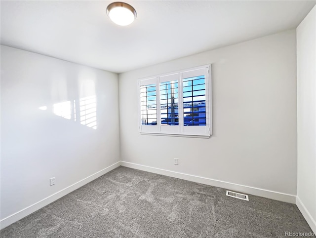 spare room featuring carpet floors