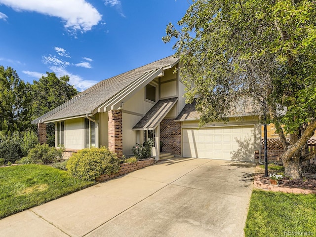 7826 S Niagara Way, Centennial, CO 80112 - view of front of home with brick siding, driveway, a shingled roof, and an attached garage