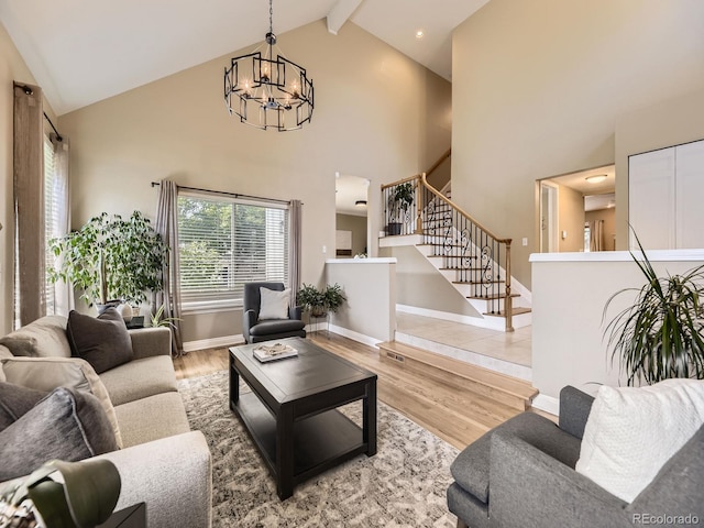 7826 S Niagara Way, Centennial, CO 80112 - living room featuring a chandelier, high vaulted ceiling, stairway, beamed ceiling, and wood finished floors