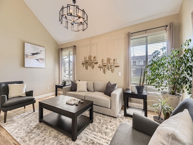 7826 S Niagara Way, Centennial, CO 80112 - living area with a chandelier, wood finished floors, and lofted ceiling