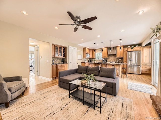 7826 S Niagara Way, Centennial, CO 80112 - living room featuring light wood finished floors, recessed lighting, and a ceiling fan