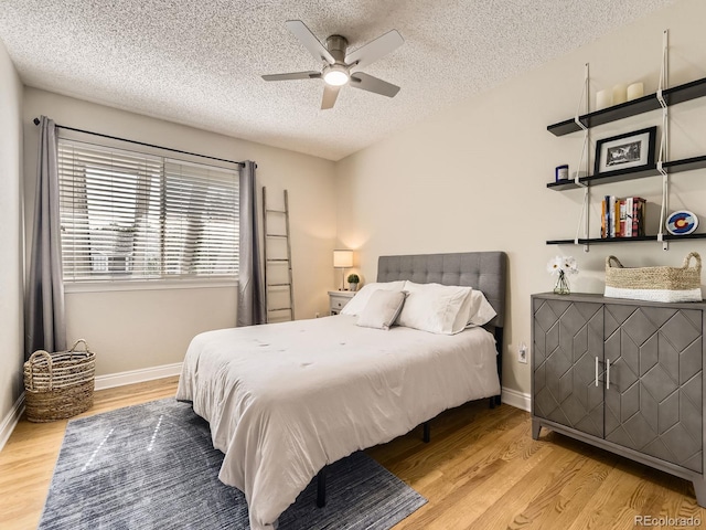 7826 S Niagara Way, Centennial, CO 80112 - bedroom featuring a textured ceiling, light wood-style floors, and a ceiling fan