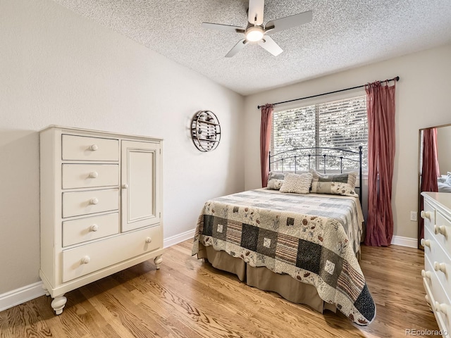 7826 S Niagara Way, Centennial, CO 80112 - bedroom featuring a textured ceiling, light wood-type flooring, and a ceiling fan