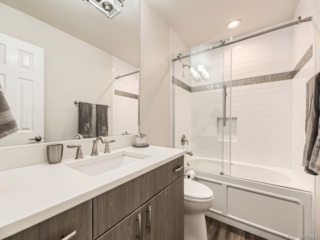7826 S Niagara Way, Centennial, CO 80112 - full bathroom with vanity, shower / bath combination with glass door, and wood finished floors