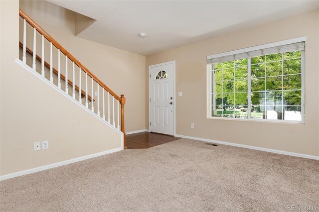 entrance foyer featuring carpet