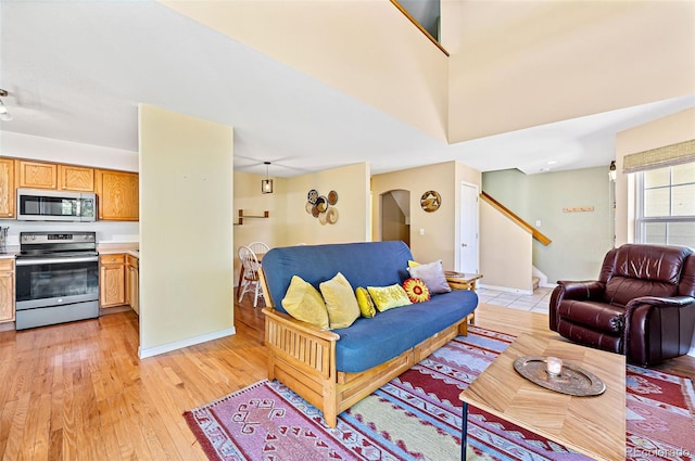 930 Button Rock Dr Unit 28, Longmont, CO 80504 - living area with stairs, light wood-style floors, and baseboards