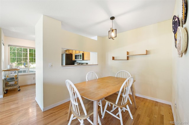 930 Button Rock Dr Unit 28, Longmont, CO 80504 - dining space with light wood-type flooring and baseboards