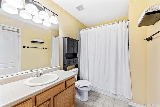 930 Button Rock Dr Unit 28, Longmont, CO 80504 - full bathroom featuring tile patterned flooring, toilet, vanity, and shower / bathtub combination with curtain