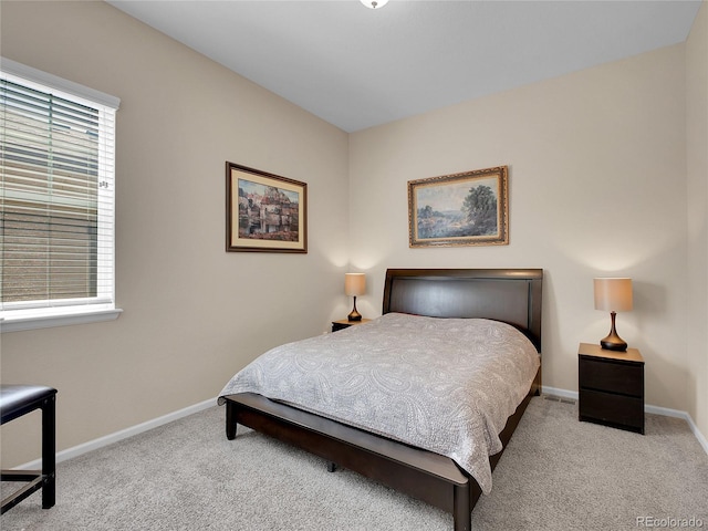 carpeted bedroom with baseboards