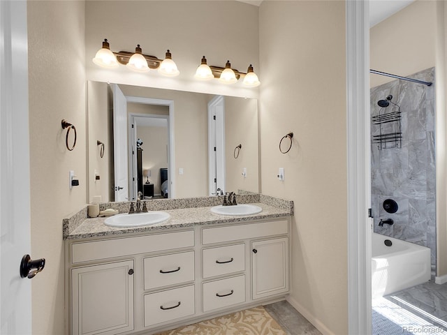 bathroom with connected bathroom, double vanity, and shower / washtub combination