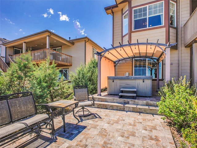 view of patio / terrace featuring a hot tub
