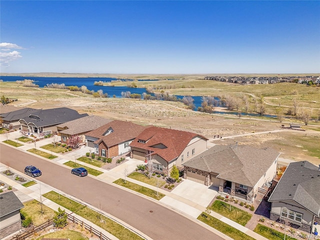aerial perspective of suburban area featuring a large body of water