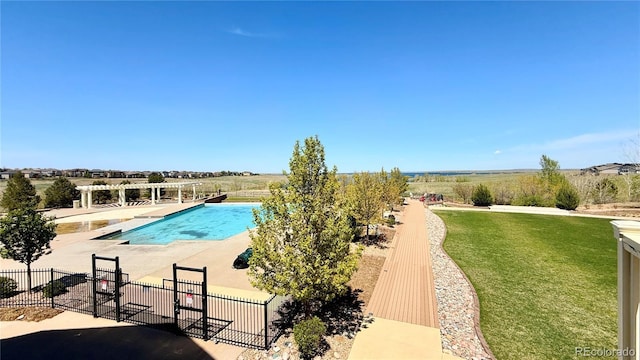 community pool featuring a pergola and a patio area
