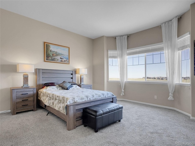 bedroom featuring carpet flooring and baseboards