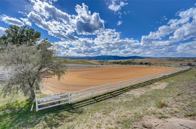 810 N Perry Park Rd, Sedalia, CO 80135 - view of yard with an enclosed horse arena, a view of countryside, and a mountain view