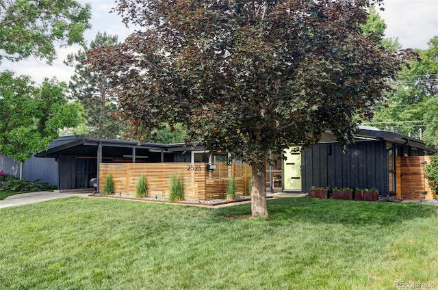 2525 S Meade St, Denver, CO 80219 - view of front of home featuring a front lawn and driveway
