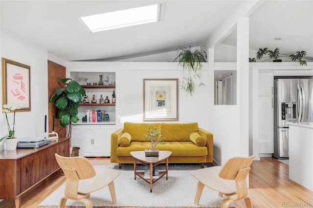 2525 S Meade St, Denver, CO 80219 - living area with light wood-type flooring and vaulted ceiling