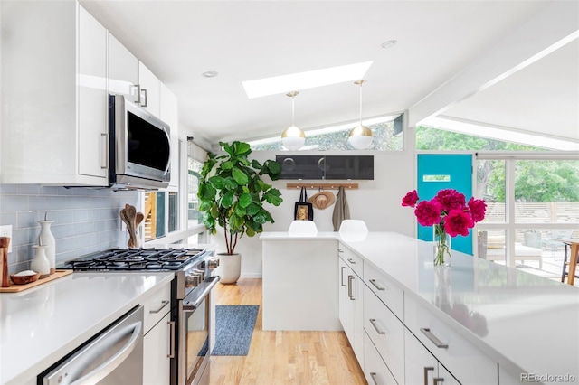 2525 S Meade St, Denver, CO 80219 - kitchen with appliances with stainless steel finishes, light wood finished floors, decorative backsplash, light countertops, and plenty of natural light