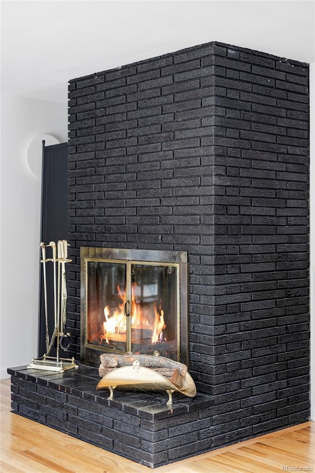 2525 S Meade St, Denver, CO 80219 - detailed view of a brick fireplace and wood finished floors