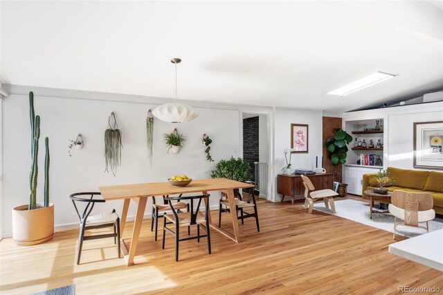 2525 S Meade St, Denver, CO 80219 - dining space featuring light wood-style flooring and lofted ceiling