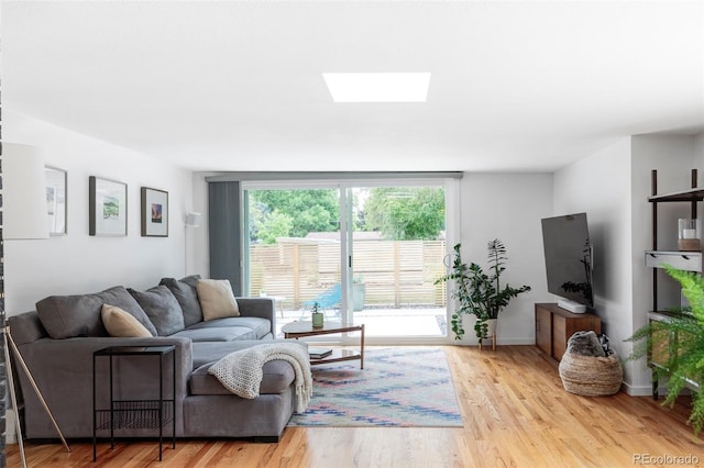 2525 S Meade St, Denver, CO 80219 - living area featuring a skylight and light wood-type flooring