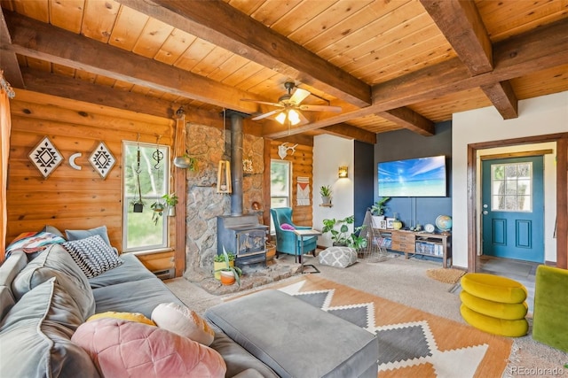 143 Juniper Rd, Black Hawk, CO 80422 - living room with a wood stove, wood ceiling with exposed beams, and ceiling fan