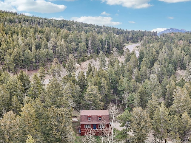 143 Juniper Rd, Black Hawk, CO 80422 - aerial overview of property's location with a heavily wooded area and a mountainous background