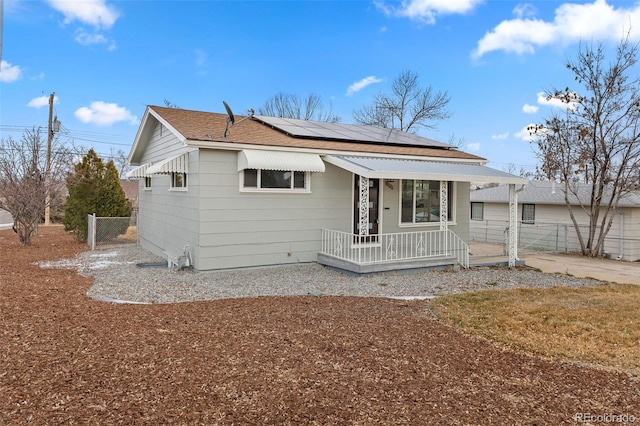 view of front of home featuring solar panels