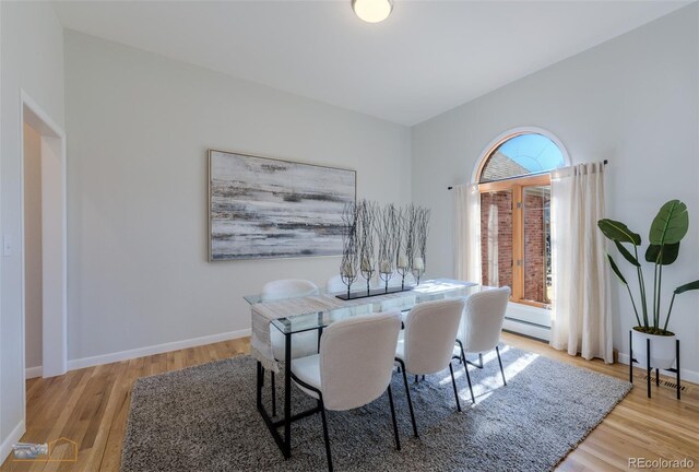 2425 Waneka Lake Trl, Lafayette, CO 80026 - dining room with wood finished floors, a baseboard radiator, and baseboards