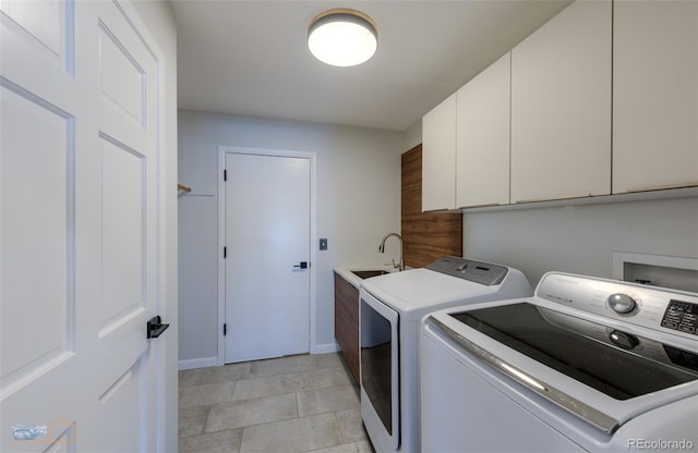 2425 Waneka Lake Trl, Lafayette, CO 80026 - laundry area featuring cabinet space, washer and clothes dryer, and baseboards