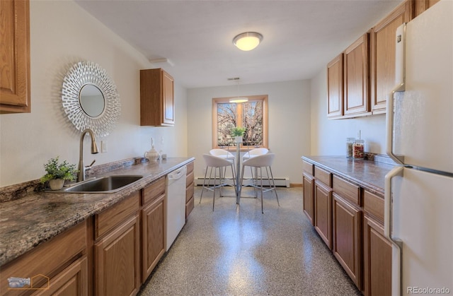 2425 Waneka Lake Trl, Lafayette, CO 80026 - kitchen featuring white appliances, a sink, baseboard heating, and brown cabinetry