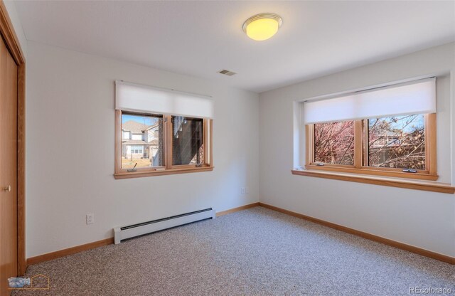 2425 Waneka Lake Trl, Lafayette, CO 80026 - empty room featuring baseboard heating, carpet floors, and baseboards
