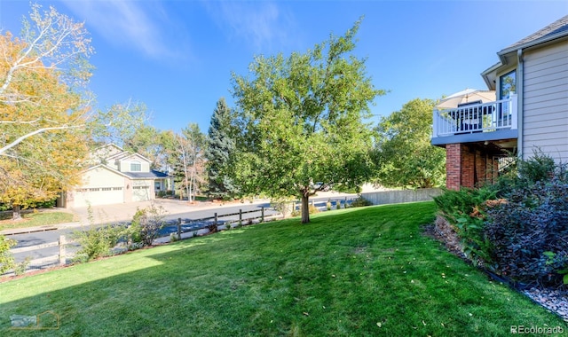 2425 Waneka Lake Trl, Lafayette, CO 80026 - view of yard featuring a garage and a wooden deck