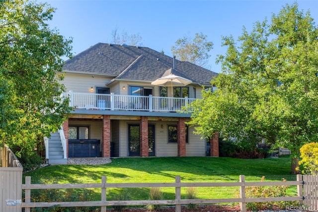 2425 Waneka Lake Trl, Lafayette, CO 80026 - view of front facade featuring a hot tub, a wooden deck, and roof with shingles