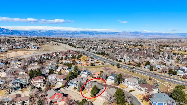 2425 Waneka Lake Trl, Lafayette, CO 80026 - aerial overview of property's location featuring a mountain backdrop and nearby suburban area