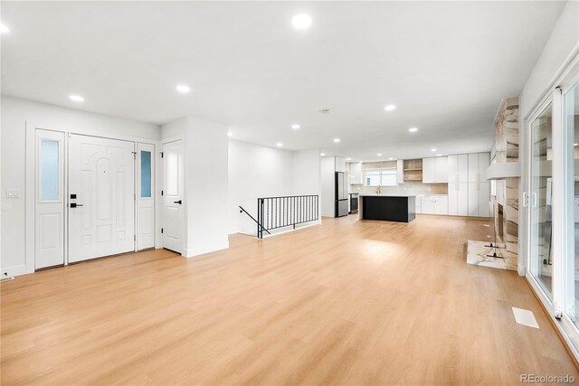 unfurnished living room featuring light hardwood / wood-style floors