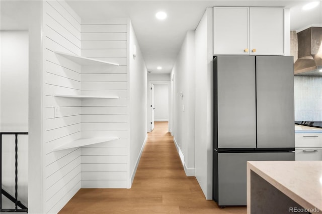 corridor featuring light hardwood / wood-style flooring