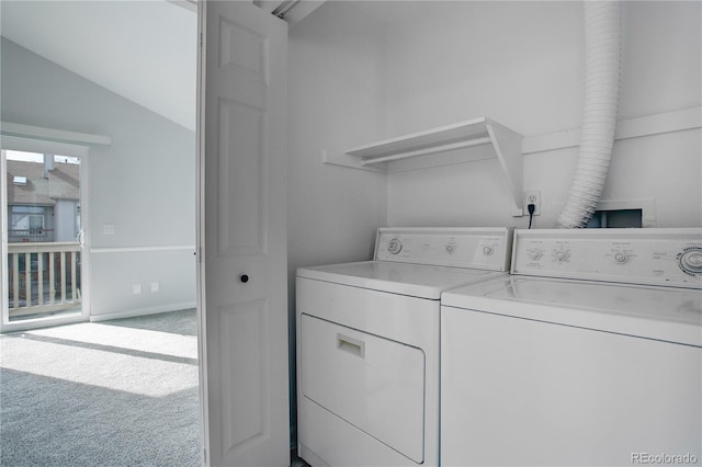 laundry room featuring washing machine and dryer and carpet