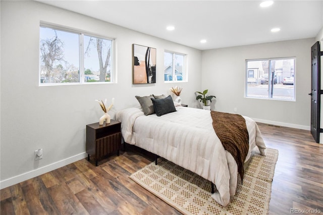 bedroom featuring dark hardwood / wood-style floors