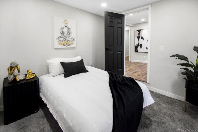 bedroom featuring dark colored carpet