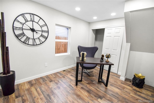 home office with dark wood-type flooring