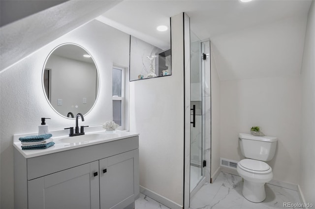 bathroom with vanity, toilet, a shower with door, and vaulted ceiling