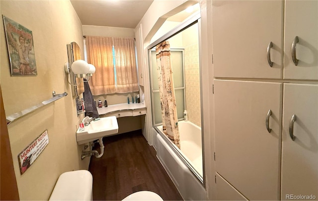 200 W 5th St, Julesburg, CO 80737 - full bath with toilet, wood finished floors, shower / tub combo, and a sink