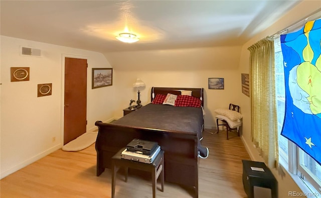 200 W 5th St, Julesburg, CO 80737 - bedroom featuring light wood-type flooring, baseboards, and lofted ceiling