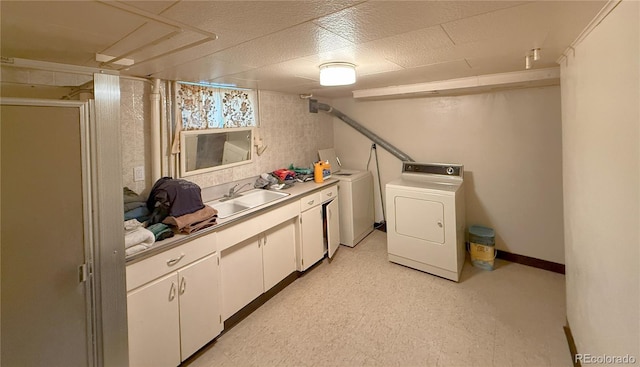 200 W 5th St, Julesburg, CO 80737 - washroom featuring washer and clothes dryer and cabinet space