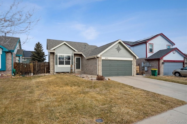 view of front facade with solar panels, a front yard, and a garage