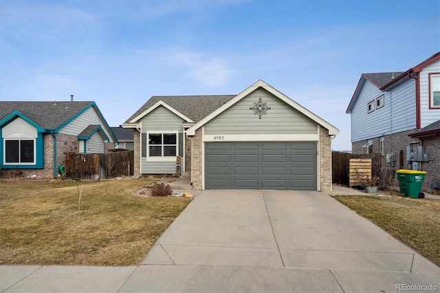 view of front of home featuring a garage and a front lawn