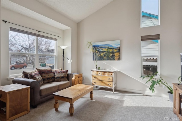 living room featuring light colored carpet, a textured ceiling, and vaulted ceiling