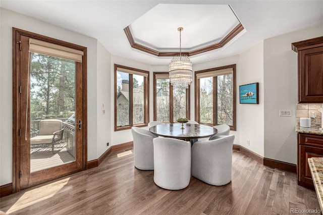 648 Ruby Trust Dr, Castle Rock, CO 80108 - dining space featuring healthy amount of natural light, a chandelier, and baseboards